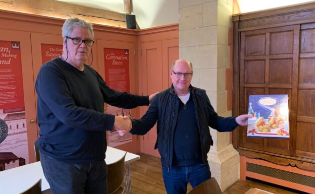 Peter Large receiving his prize from Stephen Moss