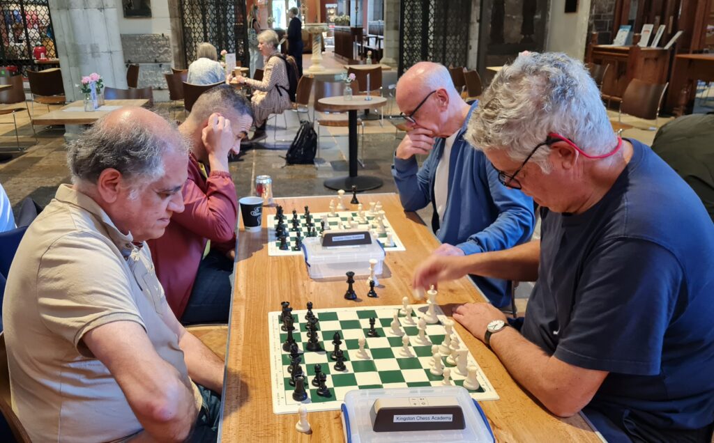 Foreground: Stephen Moss v David Shalom; Background: John Hawes v Genc Tabasi